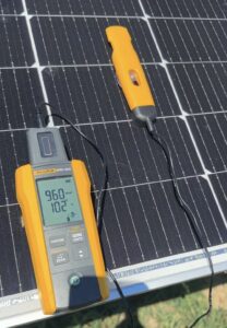 Irradiance meter measuring sunlight intensity on solar panels at a PV plant